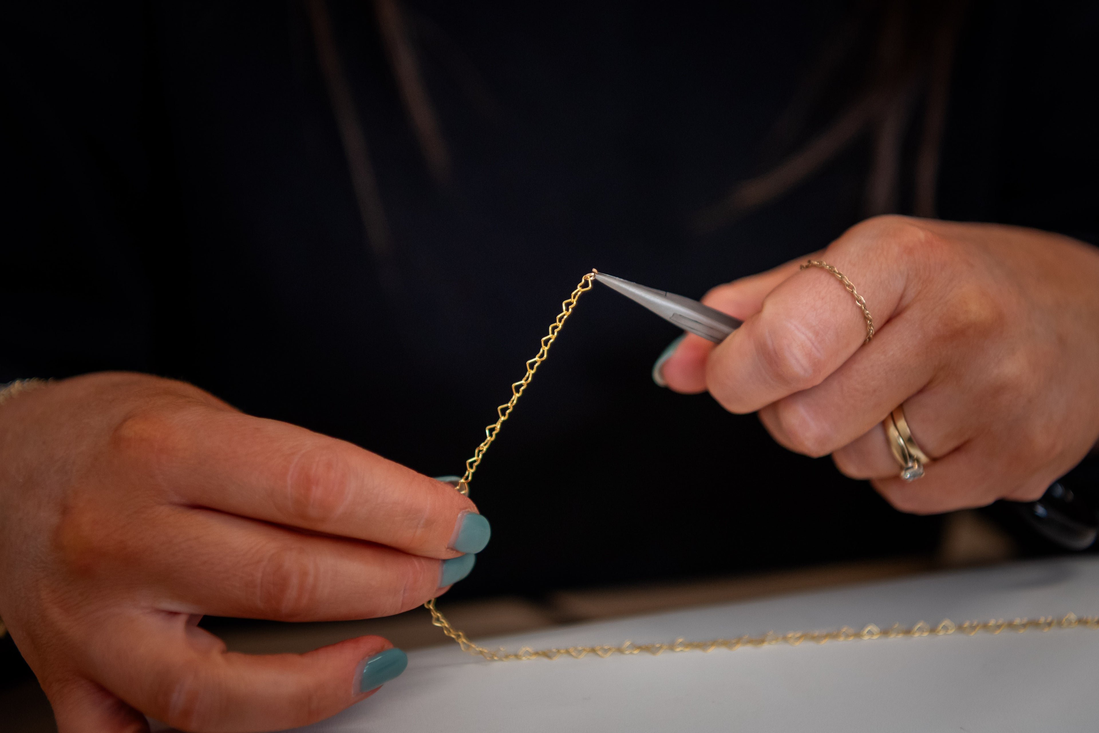Custom permanent bracelet in sterling gold at Adelia & Rose